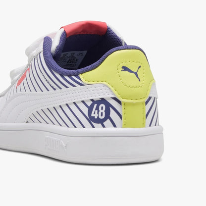 White Puma Kids Smash 3.0 sneaker with blue stripes and a yellow heel, seen from an angled view showing the side and back.