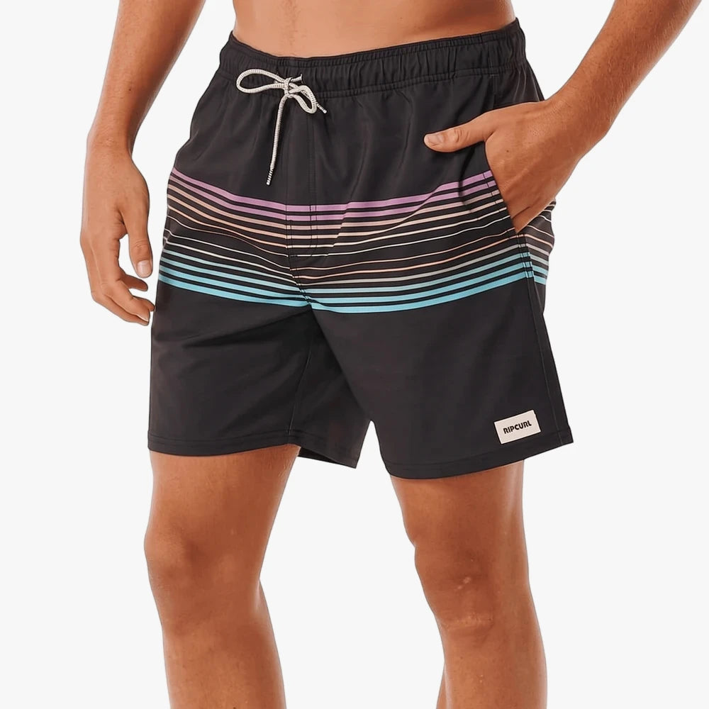 Close-up of Ripcurl Mens Bondi Volley Shorts in black with horizontal pastel stripes, worn by a man.