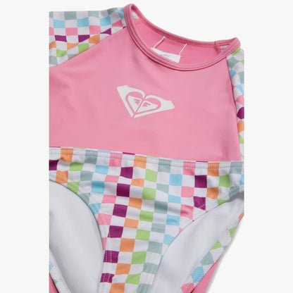 Roxy Girls Rainbow Check Long Sleeve Swim Set in pink and rainbow checkerboard pattern, shown folded.