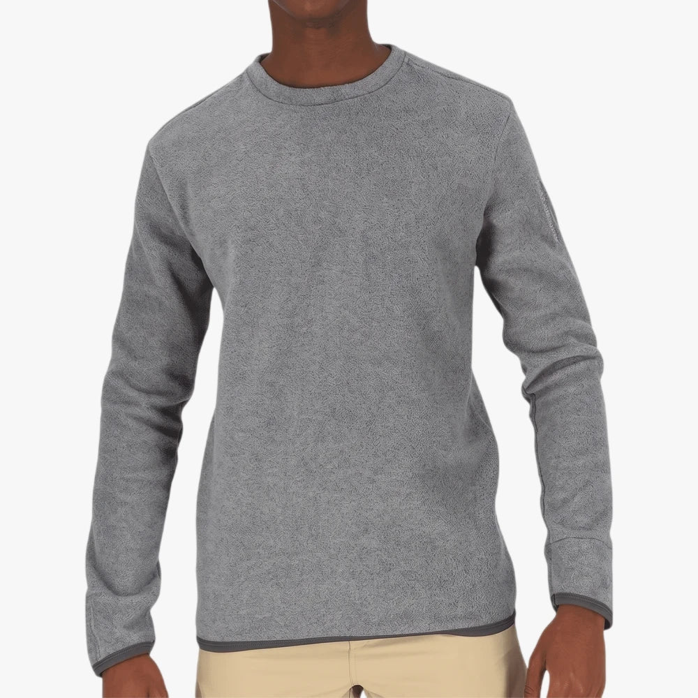 Salomon Kids Kabru Sweater Tetras Mel in a melange grey, long-sleeved and worn by a person, captured from the waist up.