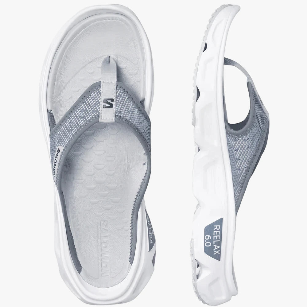 Salomon Mens Reelax Break 6.0 flip-flops in blue ashes, white, and pearl blue, shown from top and side views.