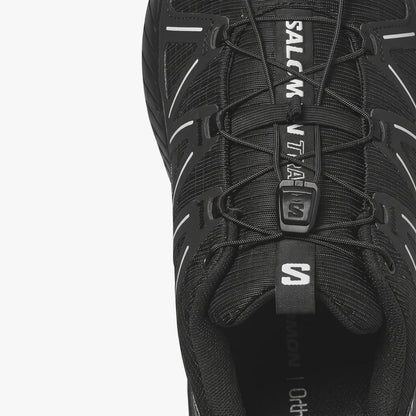 Close-up of a black Salomon Mens Speedcross Peak Trail Sneaker showing the lacing system and mesh upper.