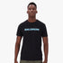 A Black man wearing a black Salomon Talima short sleeve t-shirt with a light blue Salomon logo on the chest. He stands