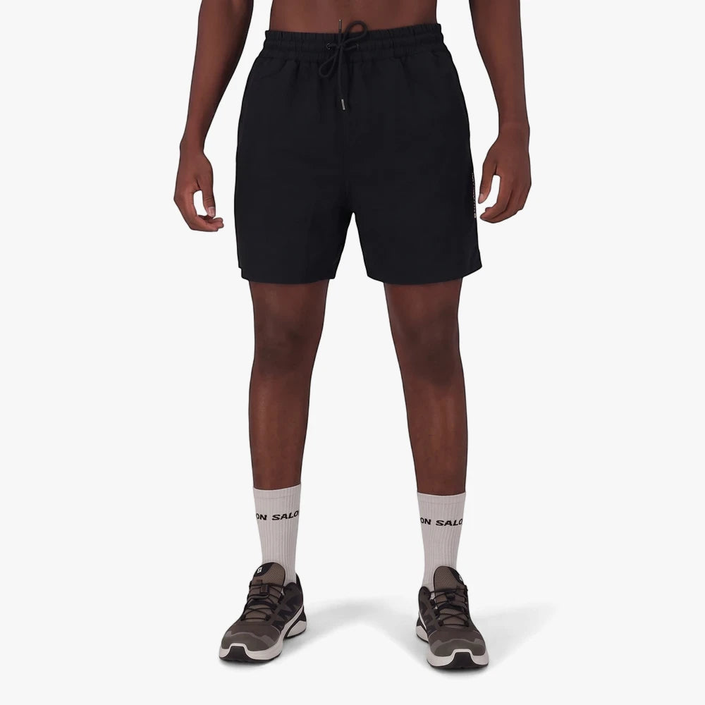 A male model wearing black Salomon Men&