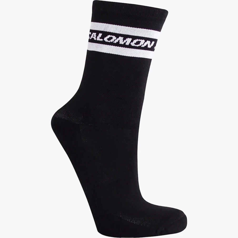 Salomon Sporty Crew Sock in black, featuring white striped accents and the Salomon logo near the cuff.