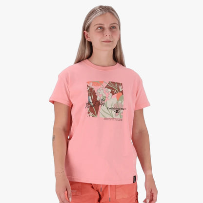 Woman wearing a Salomon Freedom Short Sleeve Tee in Murex Shell pink, featuring a unique floral graphic print.