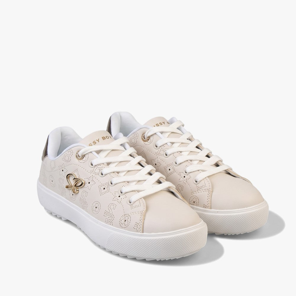A pair of Sissy Boy All Over Punched Out Sneaker Stone sneakers, featuring a cream/stone color with a perforated pattern and