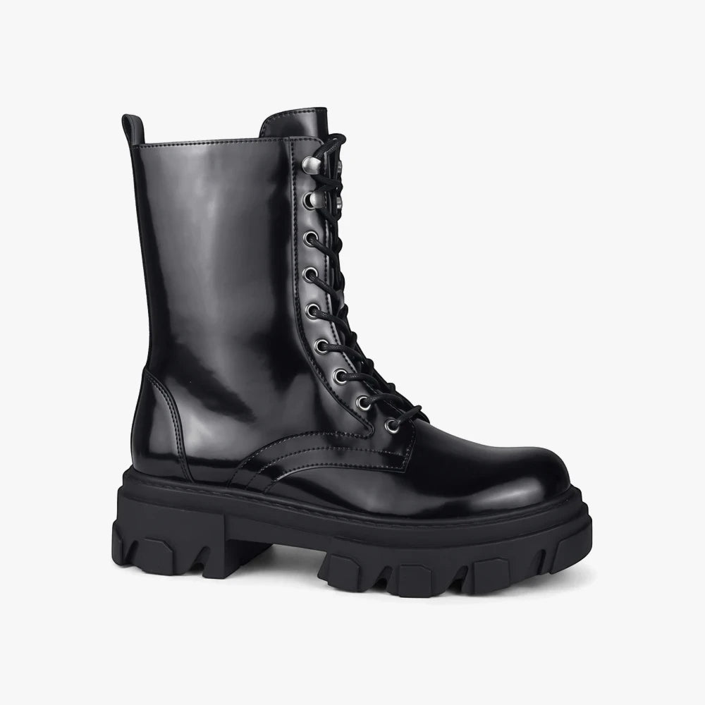 Black Sissy Boy lace-up utility boot with a chunky lug outsole, glossy patent leather-look finish, shown standing upright.