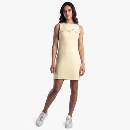 Sissy Boy Boat Neck Mini Dress in pale yellow with a gold bling logo on the chest, worn by a model in a full-body studio