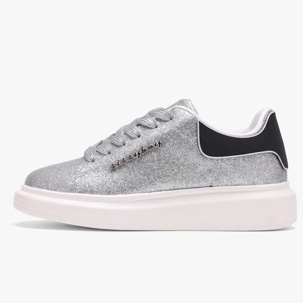 A single Sissy Boy Carter sneaker in silver glitter, featuring a chunky white platform sole and a black heel accent,