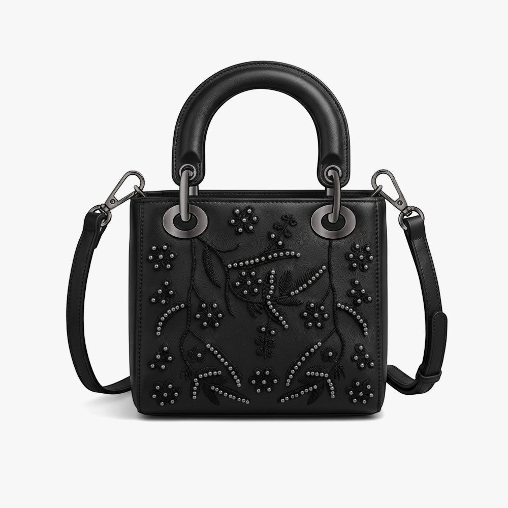 Black Sissy Boy Emma handbag with ornate floral embroidery, studded details, a top handle, and detachable shoulder strap.