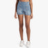 Sissy Boy High Waist Flat Front Shorts in light vintage denim with welt pockets and button detail on a female model.