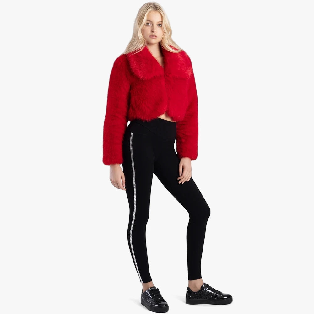 Blonde woman in Sissy Boy Joey Sculpt Knit Jeggings with side diamante tape, a red fuzzy cropped jacket, and black sparkly