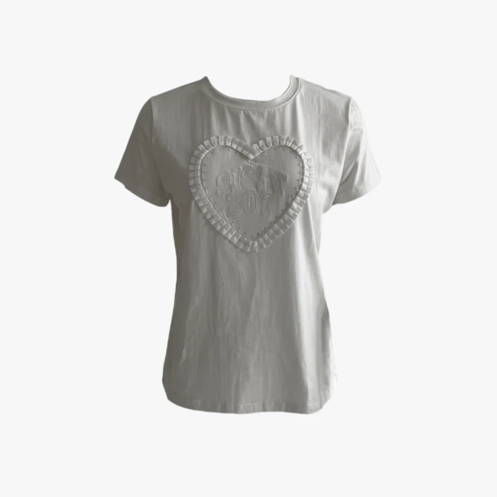 Sissy Boy white short sleeve tee featuring a large heart-shaped embroidery with ruffled ribbon detailing.
