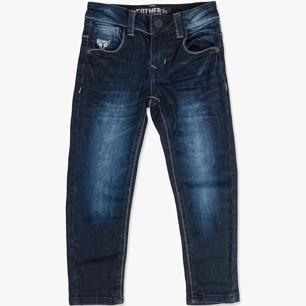 Full shot of Soviet Boys Integra Fashion Skinny Denim Blue Black jeans, laid flat. Dark blue wash with light fading, white