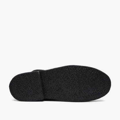 Black mono Survivor Hunter Vellies boot, showcasing its textured sole in a bottom view against a clean background.