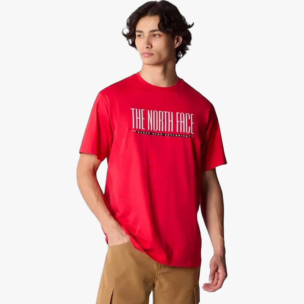 Male model wearing a red The North Face Est 1966 Short Sleeve Tee with white logo and brown cargo shorts, waist up.