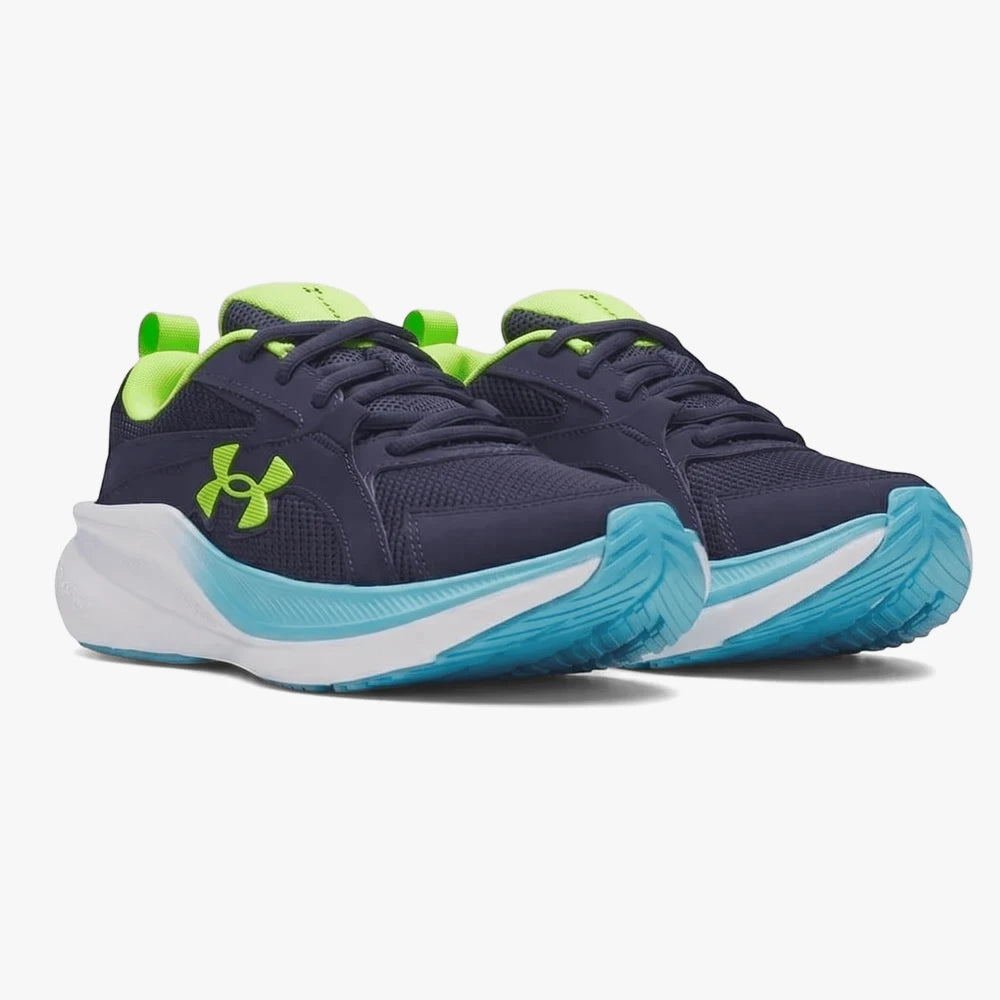 Pair of Under Armour Boys Assert 11 Sneakers in midnight navy with vibrant lime green and blue accents, designed for