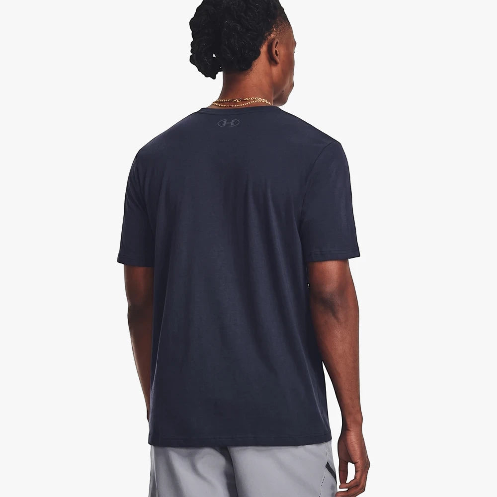 Back view of a man wearing a navy Under Armour Men&