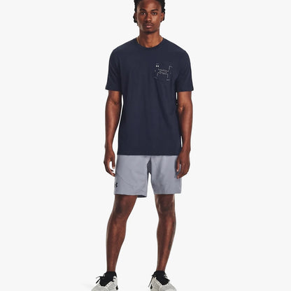 Full body shot of a man wearing a navy Under Armour Men&