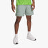 Under Armour Mens Launch 7" Shorts in light green and grey, worn by a man, featuring a neon stripe and logo.