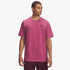 Male model wearing a pink Under Armour Mens Sportstyle Left Chest Short Sleeve Tee. Front view of the t-shirt.