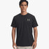A man wearing a black Under Armour Mens Sportstyle Left Chest Short Sleeve Tee with a metallic grey logo.