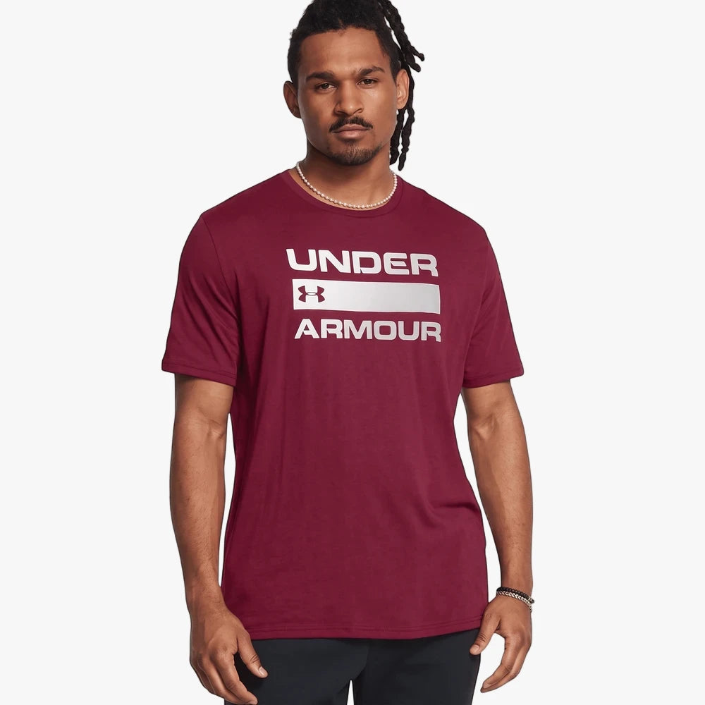 Under Armour Mens Team Issue Wordmark Short Sleeve Tee in maroon, featuring a silver logo on the chest, worn by a man.