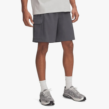 Under Armour Mens Vibe Woven Cargo Shorts in Castlerock grey worn by a model, showing the side cargo pocket and athletic