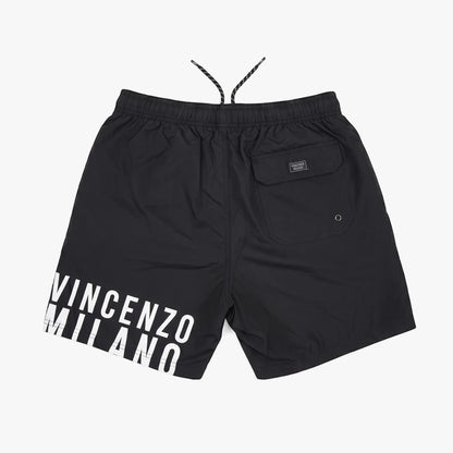 Black Vincenzo Milano mens swim shorts, flat lay, shown from the back with a white logo print on the leg.