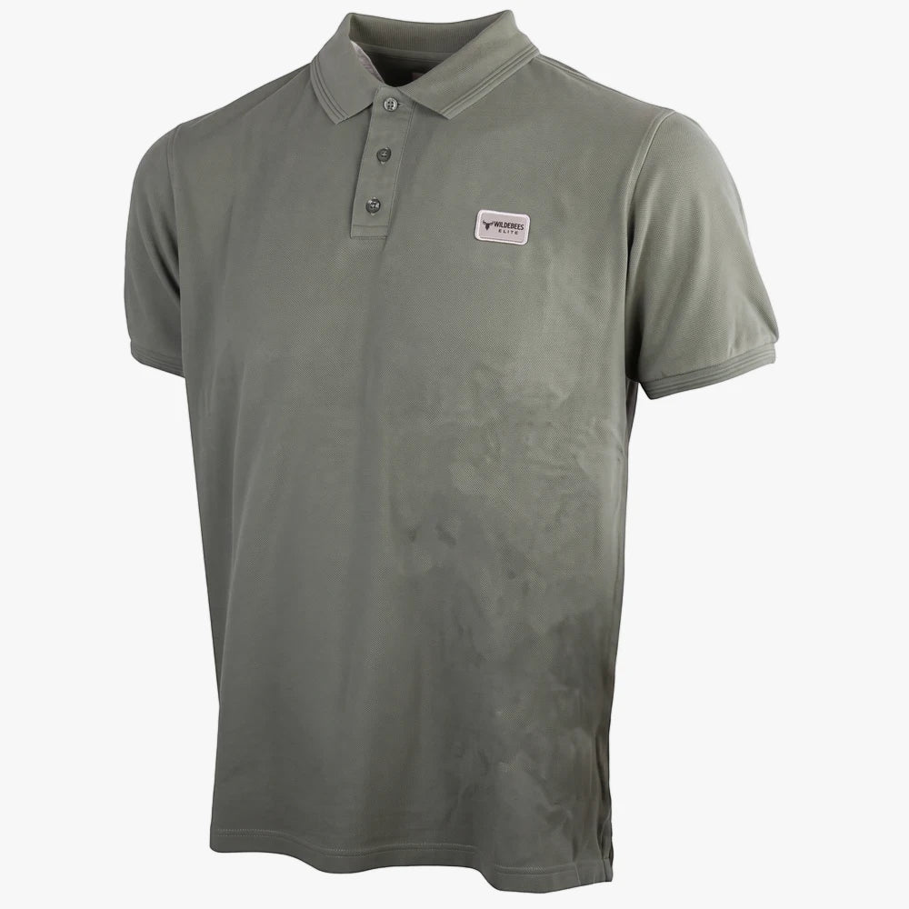 Wildebees Mens Elite Pigment Overdye Short Sleeve Golfer in sage green, featuring a ribbed collar, three-button placket, and